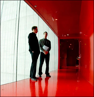 Men in Red Hallway